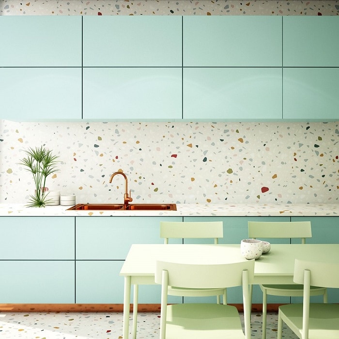 Gạch Terrazzo nổi bật với màu trắng - cam - đỏ - xanh phối cùng đồ nội thất cùng tông màu giúp tạo điểm nhấn thú vị